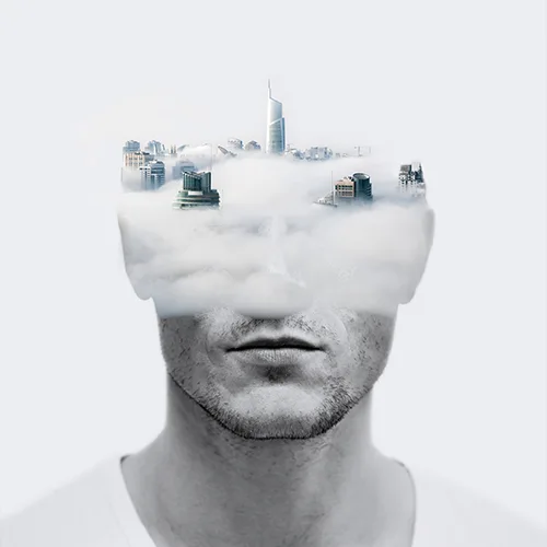 Lavoro di Photomanipulation raffigurante un uomo fuso ad una città sulle nuvole.